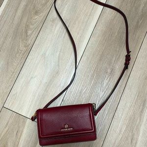 Michael Kors crossbody convertible clutch in textured burnished red.